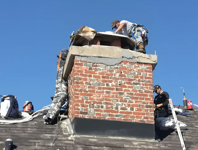 North Royalton Chimney Sweep installing a custom chimney crown in North Royalton, OH