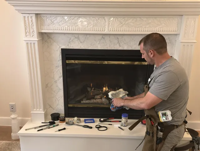 North Royalton Chimney Sweep performing fireplace maintenance in North Royalton, OH